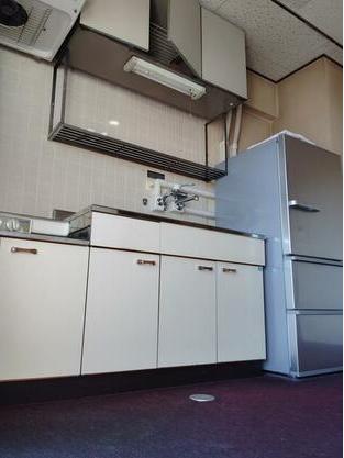 日明コータース